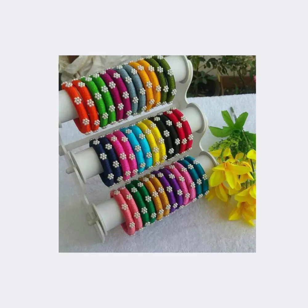 colorful-silk-thread-bangles-for-kids-with-charms Bright multi-colored silk thread bangles for kids with small gold beads and cute star charms