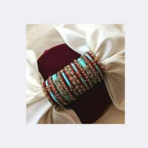Home A beautiful gift-wrapped box containing premium multi-colored silk thread bangles for gifting
